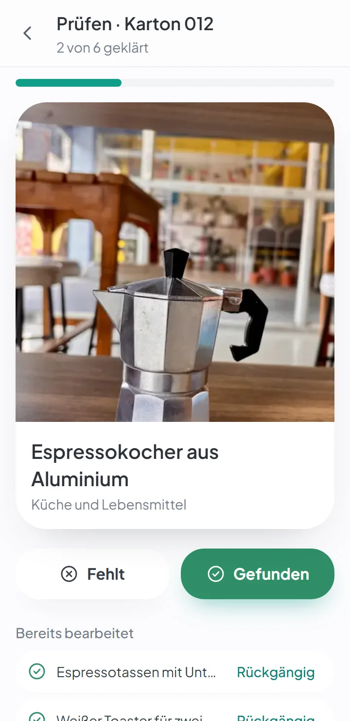 Der Bildschirm zum Auspacken, mit einem großen Foto eines Artikels und den Schaltflächen „Gefunden“ und „Fehlt“.