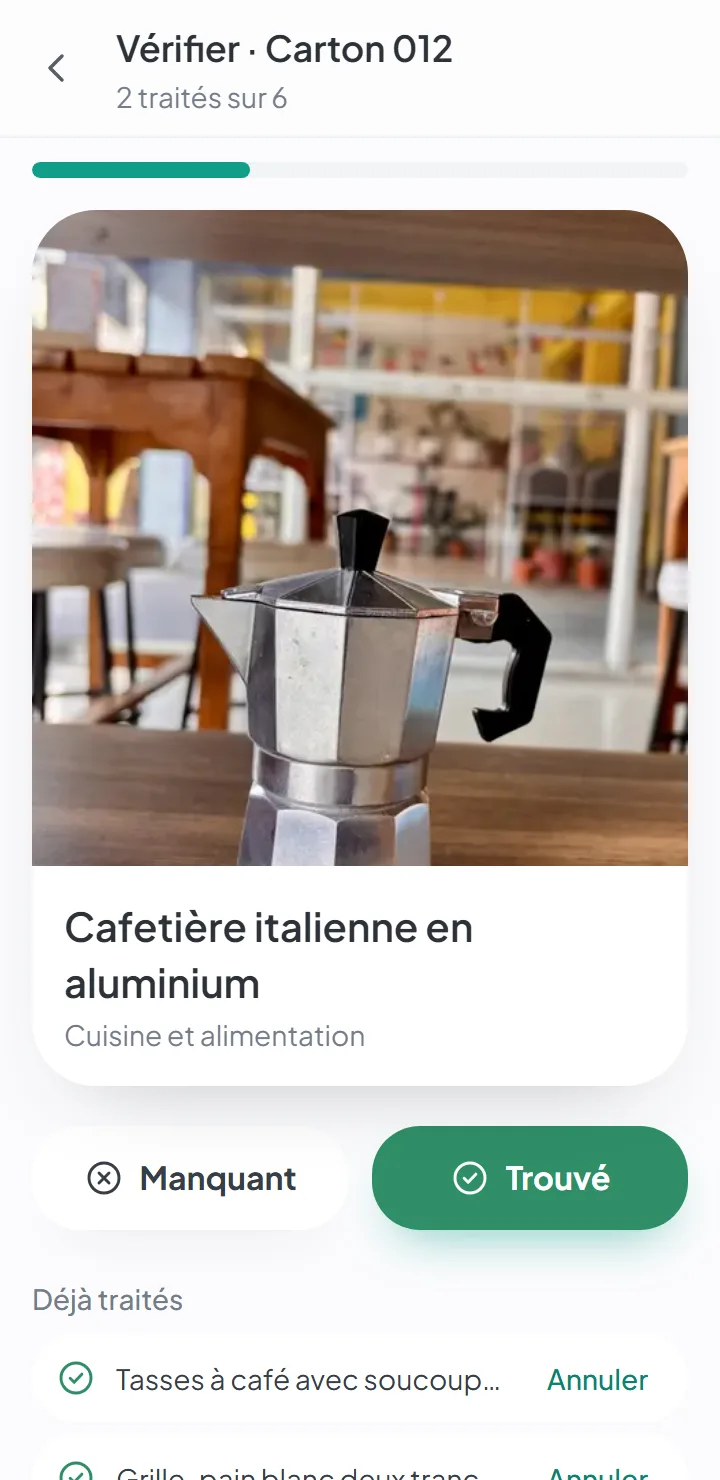 L’écran de déballage, avec une grande photo d’un article et les boutons « Trouvé » et « Manquant ».